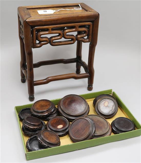 A Chinese hardwood vase stand, 28cm, together with a box of smaller circular stands